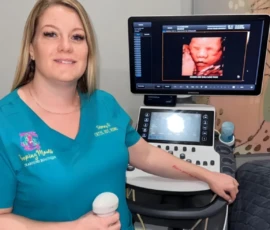 Our certified ultrasound specialists offer compassionate and professional care Sonographer performing ultrasound scan at Peeping Moms Ultrasound Boutique