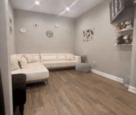 A cozy ultrasound room designed for comfort and relaxation. Ultrasound room at Peeping Moms Ultrasound Boutique