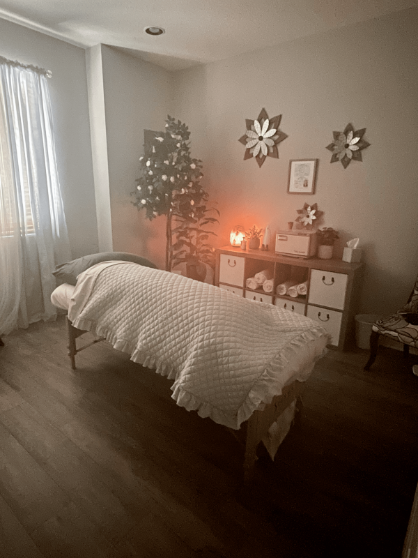 Massage room with table and soothing decor