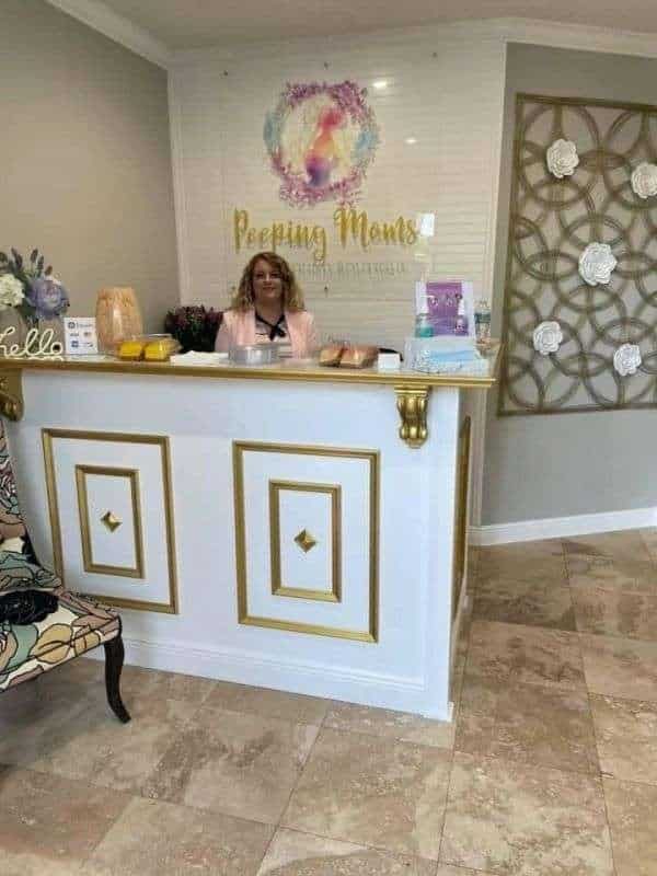 Upscale gold & white reception desk at Peeping Moms Ultrasound